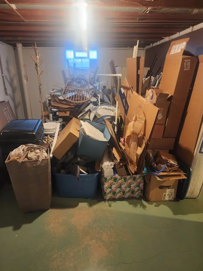 Roll-off dumpster container at job site for Yard Waste Dumpster Rental in Manor